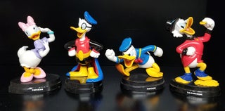 Item #31625 A Group of Eight Italian Disney Figurines. (Donald Duck, Uncle Scrooge, Mickey Mouse,...