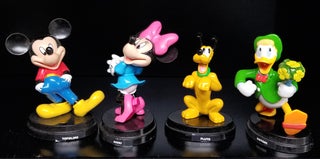 A Group of Eight Italian Disney Figurines. (Donald Duck, Uncle Scrooge, Mickey Mouse, Minnie Mouse, etc.)