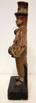 Vintage Cast Iron Boy Holding Fruit Door Stop.
