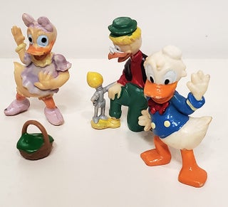 A Group of Nine Vintage Disney Mini Figurines. (Donald Duck, Uncle Scrooge, Daisy Duck, Gyro Gearloose, Grandma Duck, etc.)