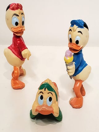 A Group of Nine Vintage Disney Mini Figurines. (Donald Duck, Uncle Scrooge, Daisy Duck, Gyro Gearloose, Grandma Duck, etc.)