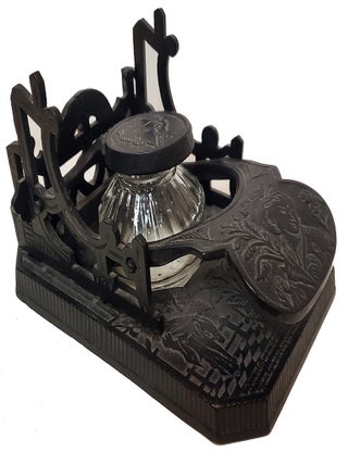 Brooke & Co. Cast Iron Mechanical Inkwell and Pen Holder with Japanese Geisha Motifs.