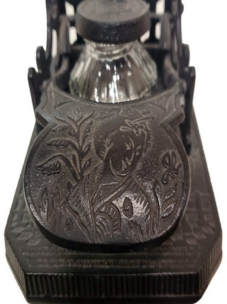 Brooke & Co. Cast Iron Mechanical Inkwell and Pen Holder with Japanese Geisha Motifs.