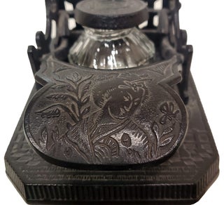 Brooke & Co. Cast Iron Mechanical Inkwell and Pen Holder with Japanese Geisha Motifs.