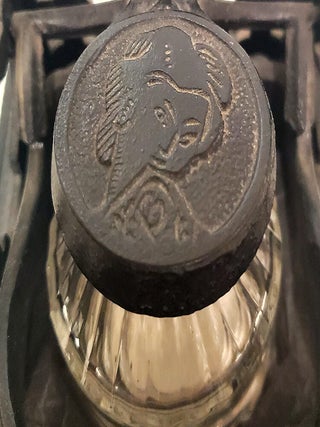 Brooke & Co. Cast Iron Mechanical Inkwell and Pen Holder with Japanese Geisha Motifs.
