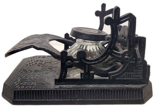 Brooke & Co. Cast Iron Mechanical Inkwell and Pen Holder with Japanese Geisha Motifs.